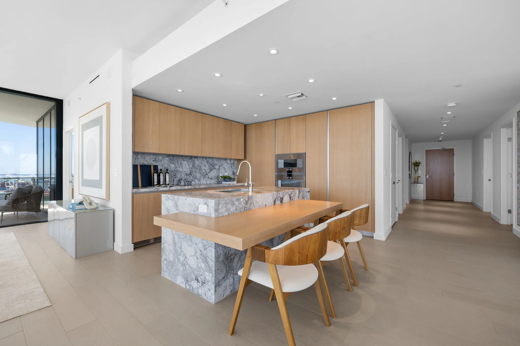 Gourmet kitchen with Italian oak cabinetry, quartzite countertops, and premium appliances.