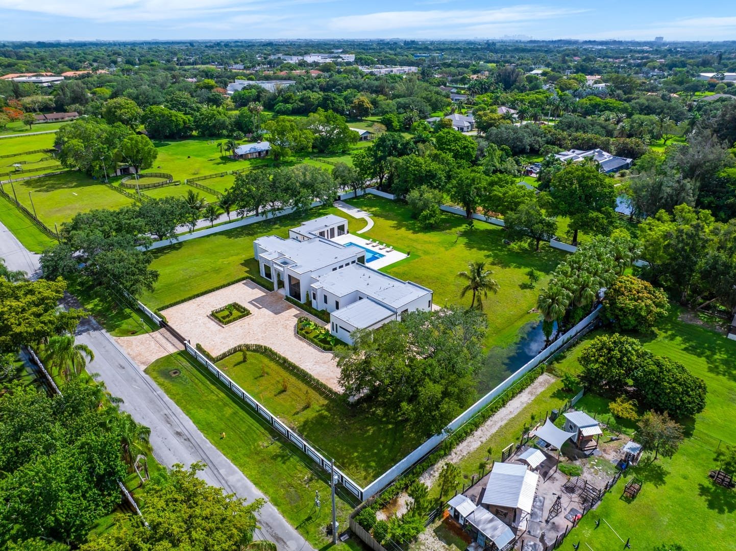 Aerial overview of a Cooper City luxury estate photographed by drone