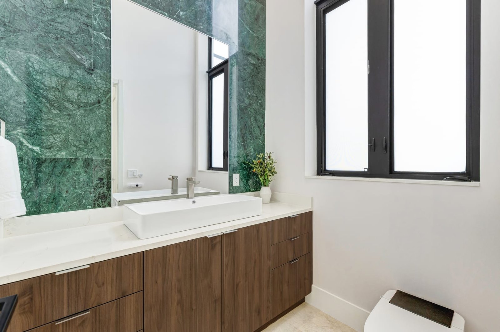 Bathroom vanity and marble detail inside a Cooper City luxury estate