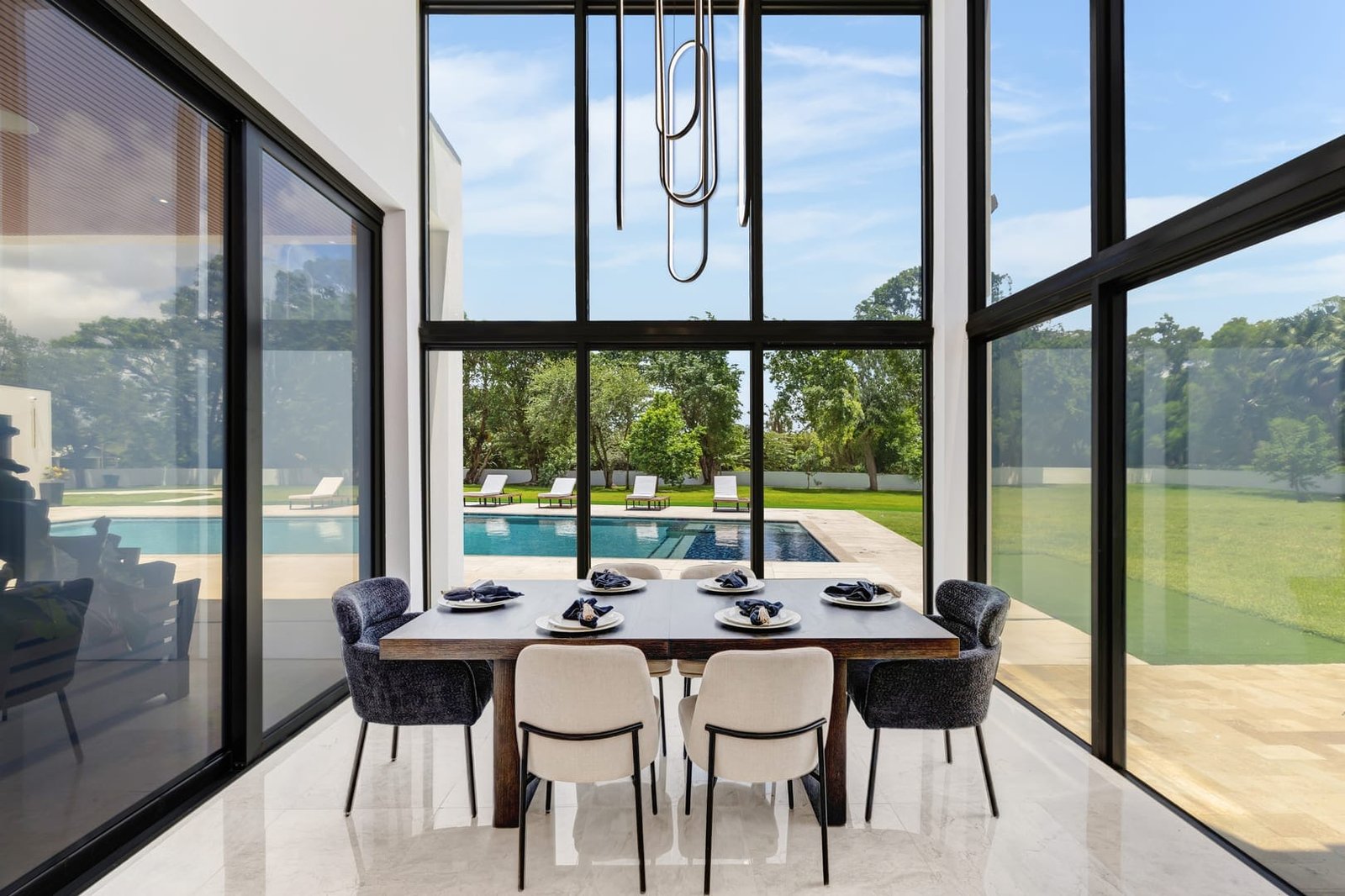 Dining area with pool view inside a Cooper City luxury estate