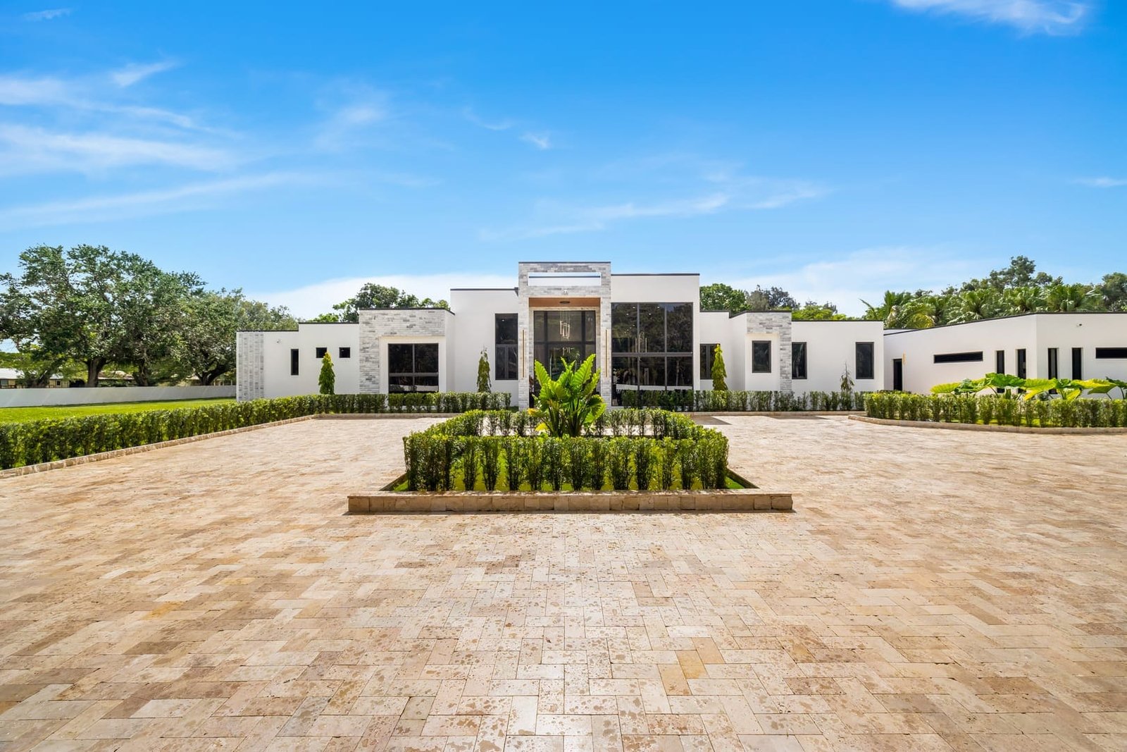 Front courtyard and contemporary exterior of a Cooper City luxury estate
