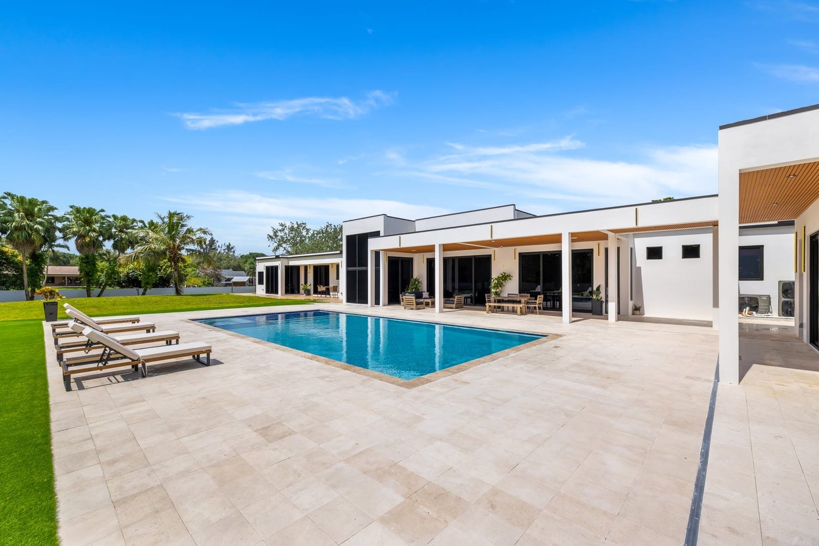 Pool terrace and outdoor lounge at a Cooper City luxury estate